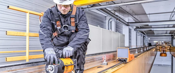 Worker on crane girder